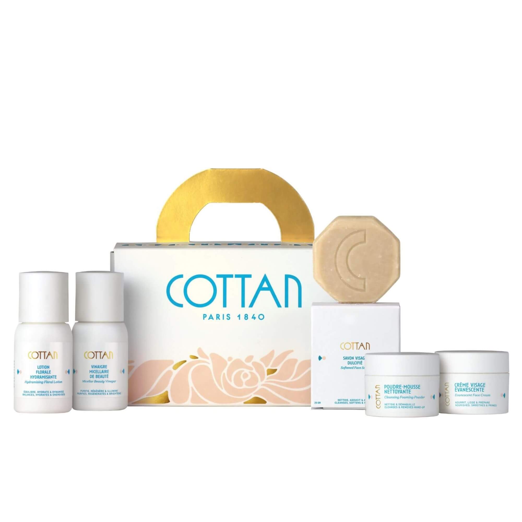 Vista frontal del estuche de viaje Rituel Arsène de COTTAN, que incluye los formatos de viaje de la loción floral hidratante, el vinagre micelar de belleza, el jabón facial suavizante, el polvo limpiador espumoso y la crema facial Évanescente.