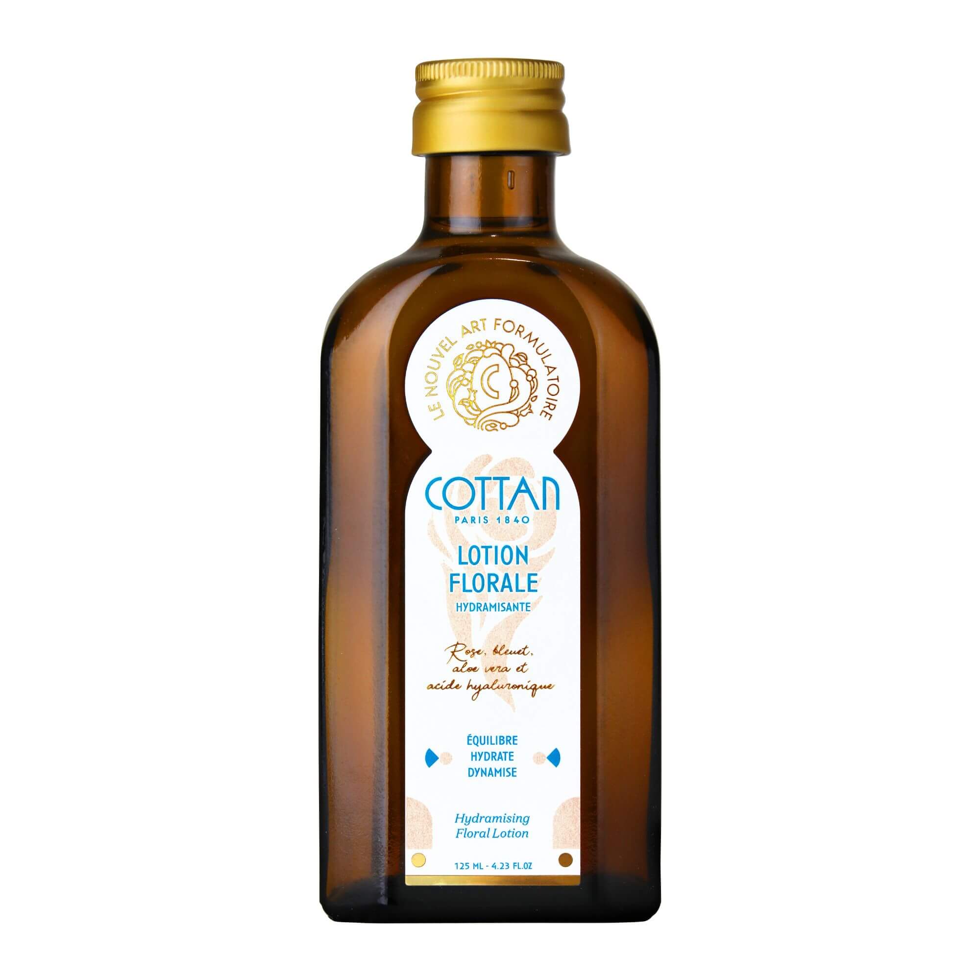 Vista frontal del frasco de loción floral Hydramisante COTTAN sin su embalaje. El frasco de color marrón transparente deja ver el líquido que contiene y la etiqueta frontal muestra el nombre y la marca del producto.