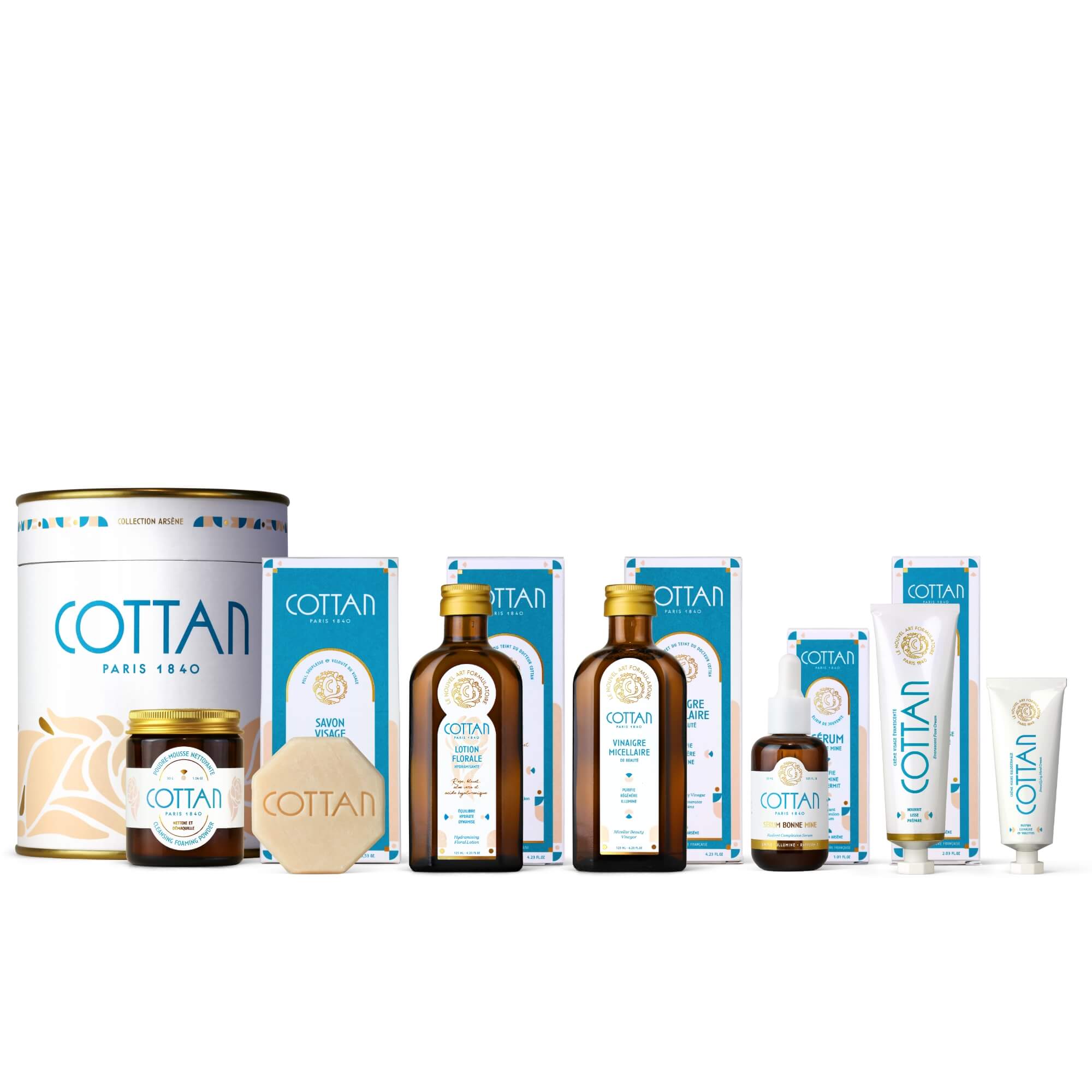 Vue de face de la Routine Complète COTTAN avec tous les soins visage accompagnés de leurs étuis et du coffret cylindrique Collection Arsène. Coffret de soins visage haut de gamme réunissant nettoyage, purification, hydratation, éclat et nutrition pour une routine experte et complète.