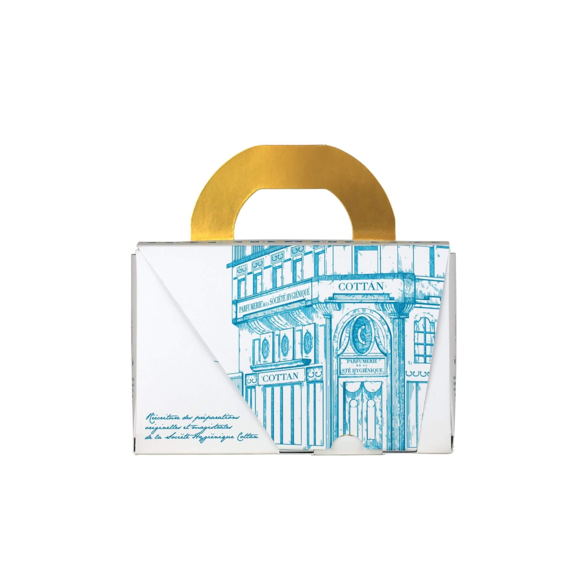 Vista trasera de la caja del estuche de viaje Rituel Arsène de COTTAN, con una ilustración patrimonial de la perfumería histórica y los elementos gráficos de la marca.